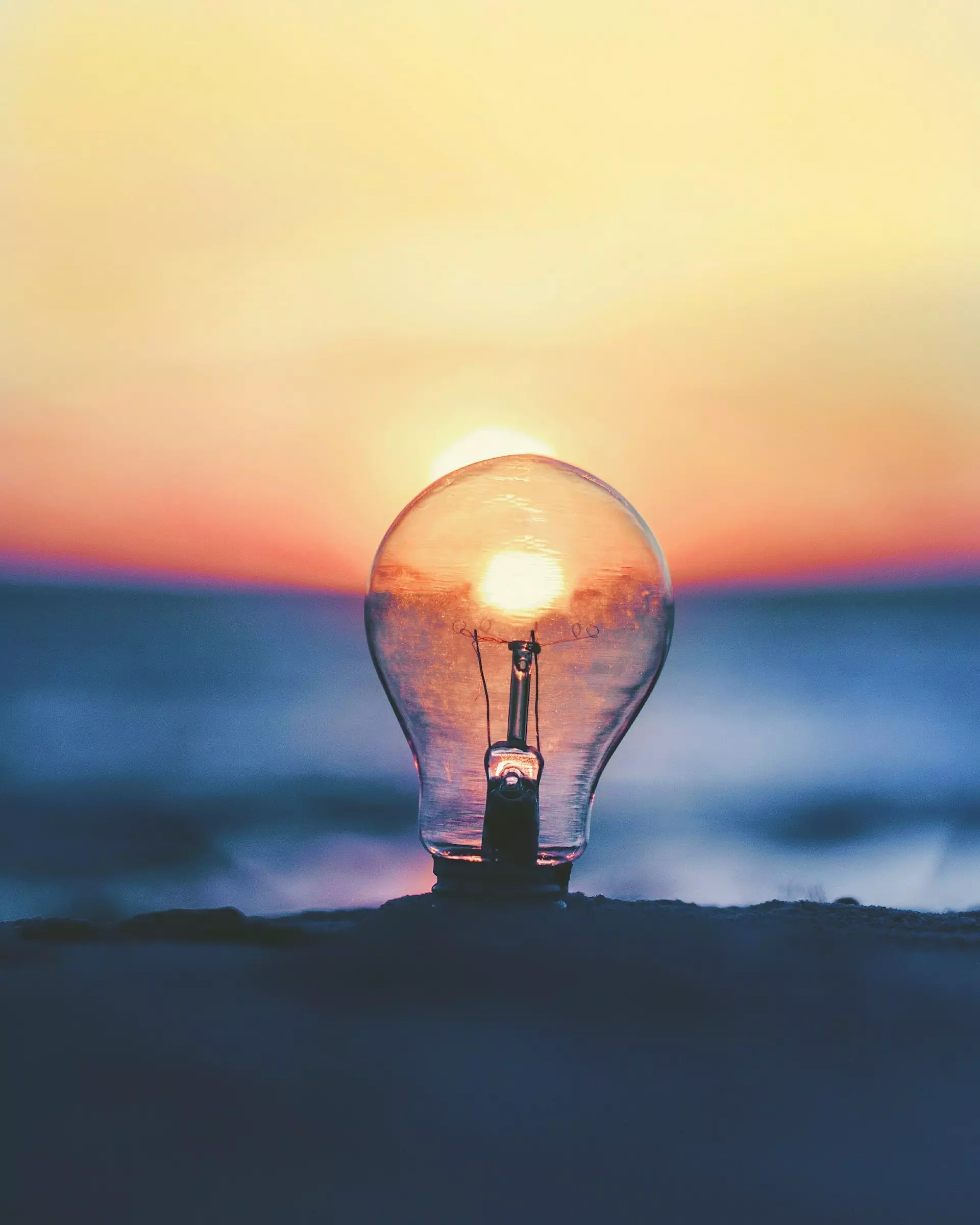 Sunset viewed through a clear lightbulb