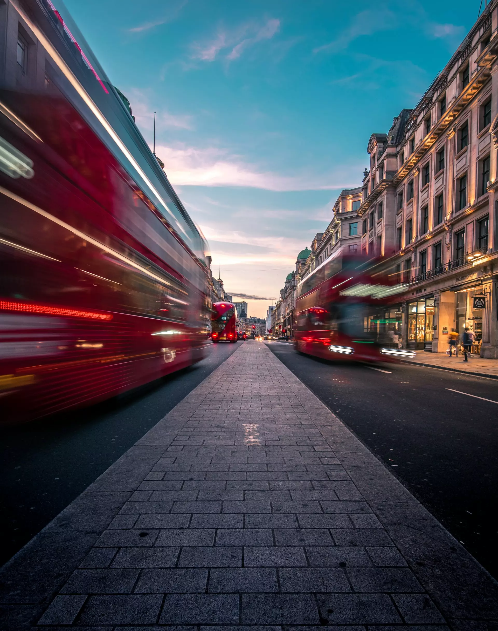 A view down a busy London street with red double-decker buses