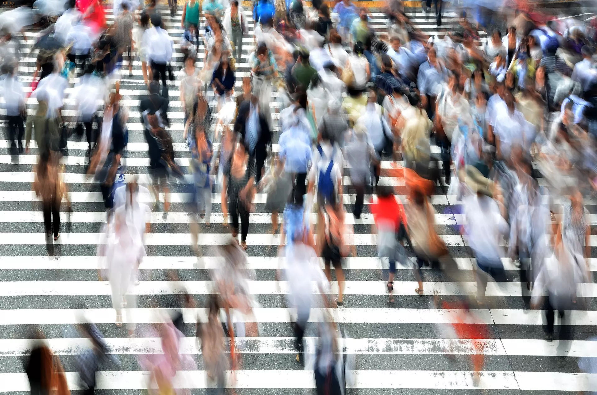 Pedestrians on a busy zebra crossing