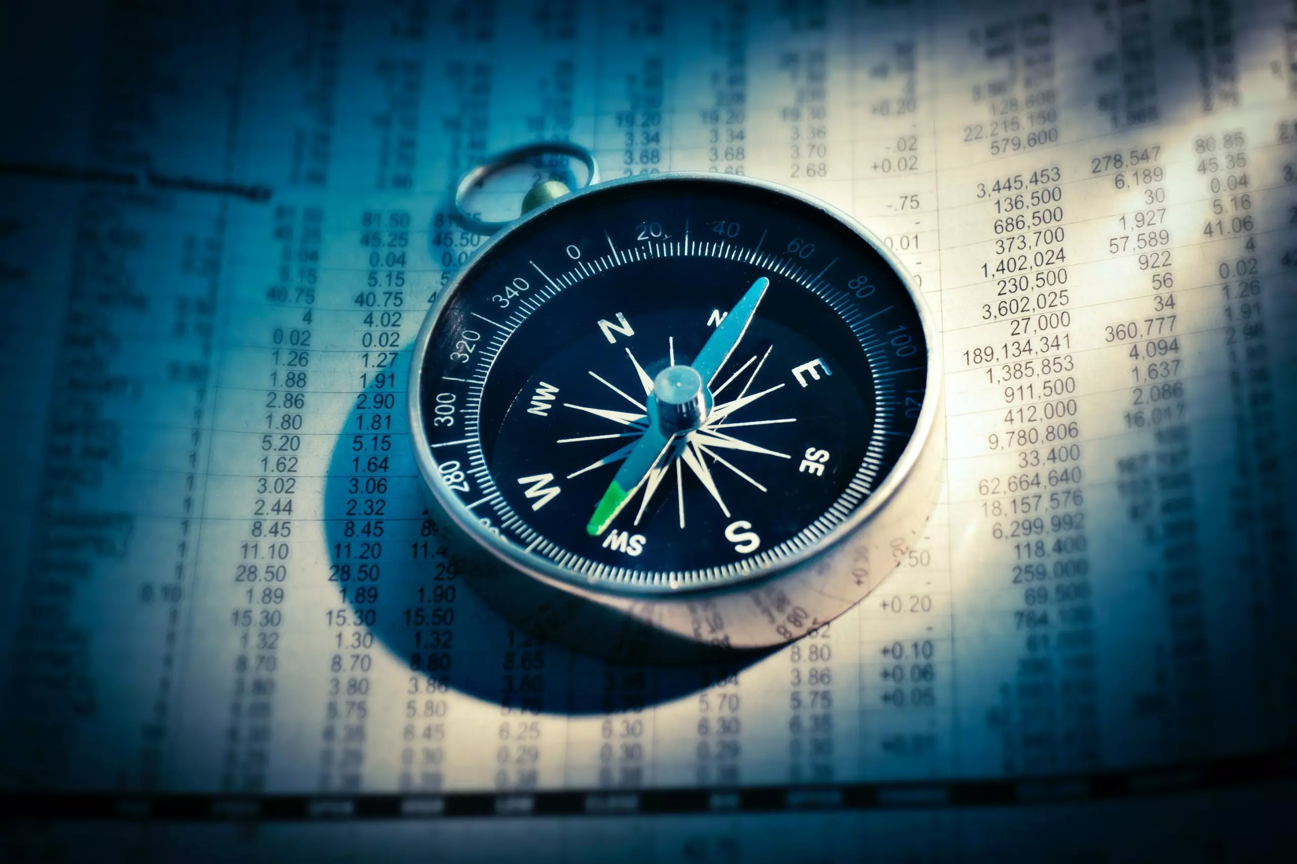 A compass on a sheet of numerical data